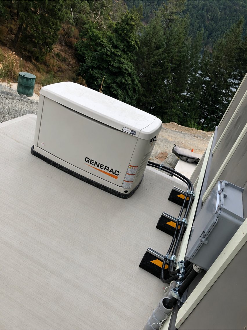 Generac standby generator on a concrete pad, installed by Peak Electrical