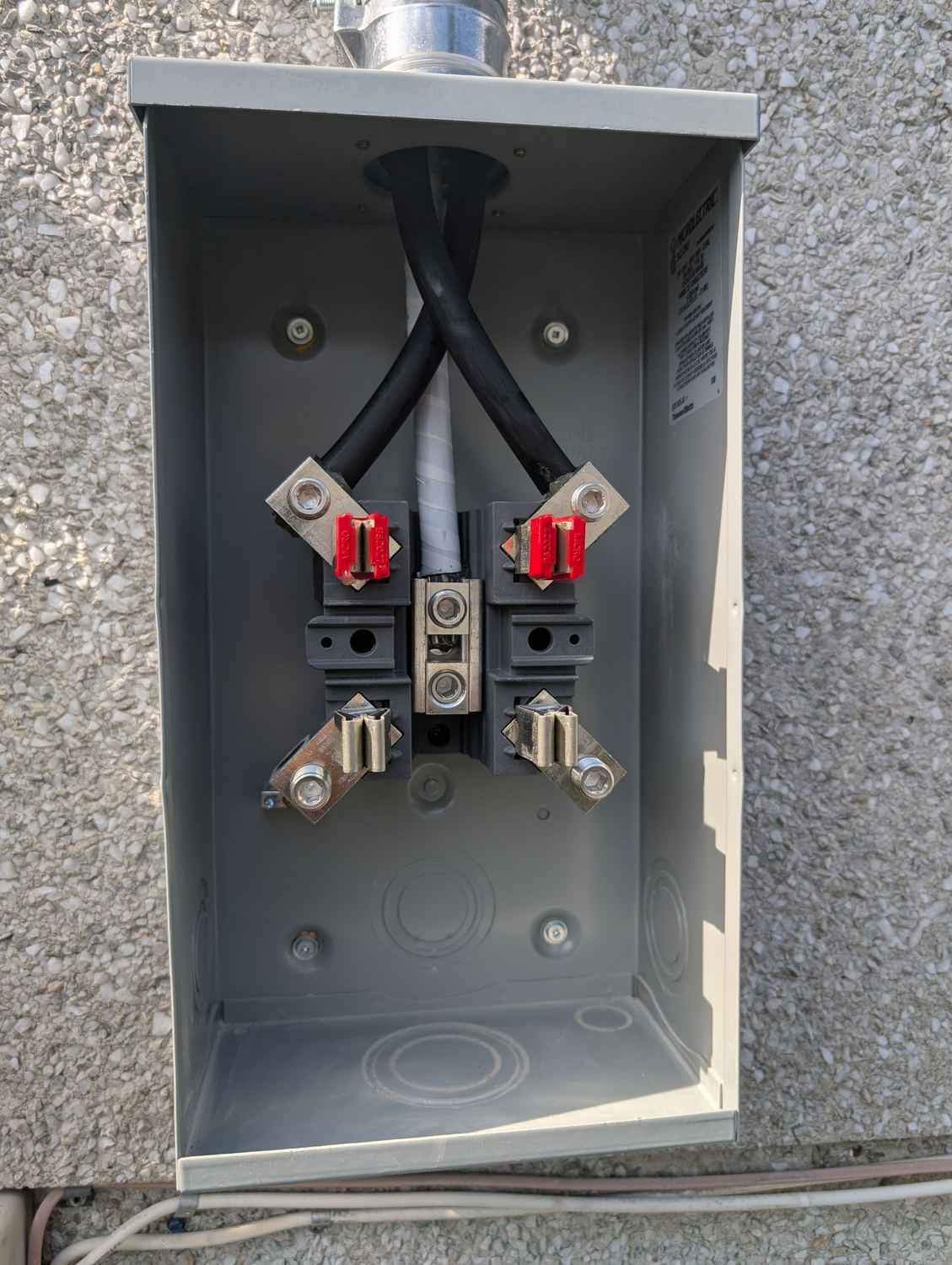 New meter base with clean terminations, installed by Peak Electrical